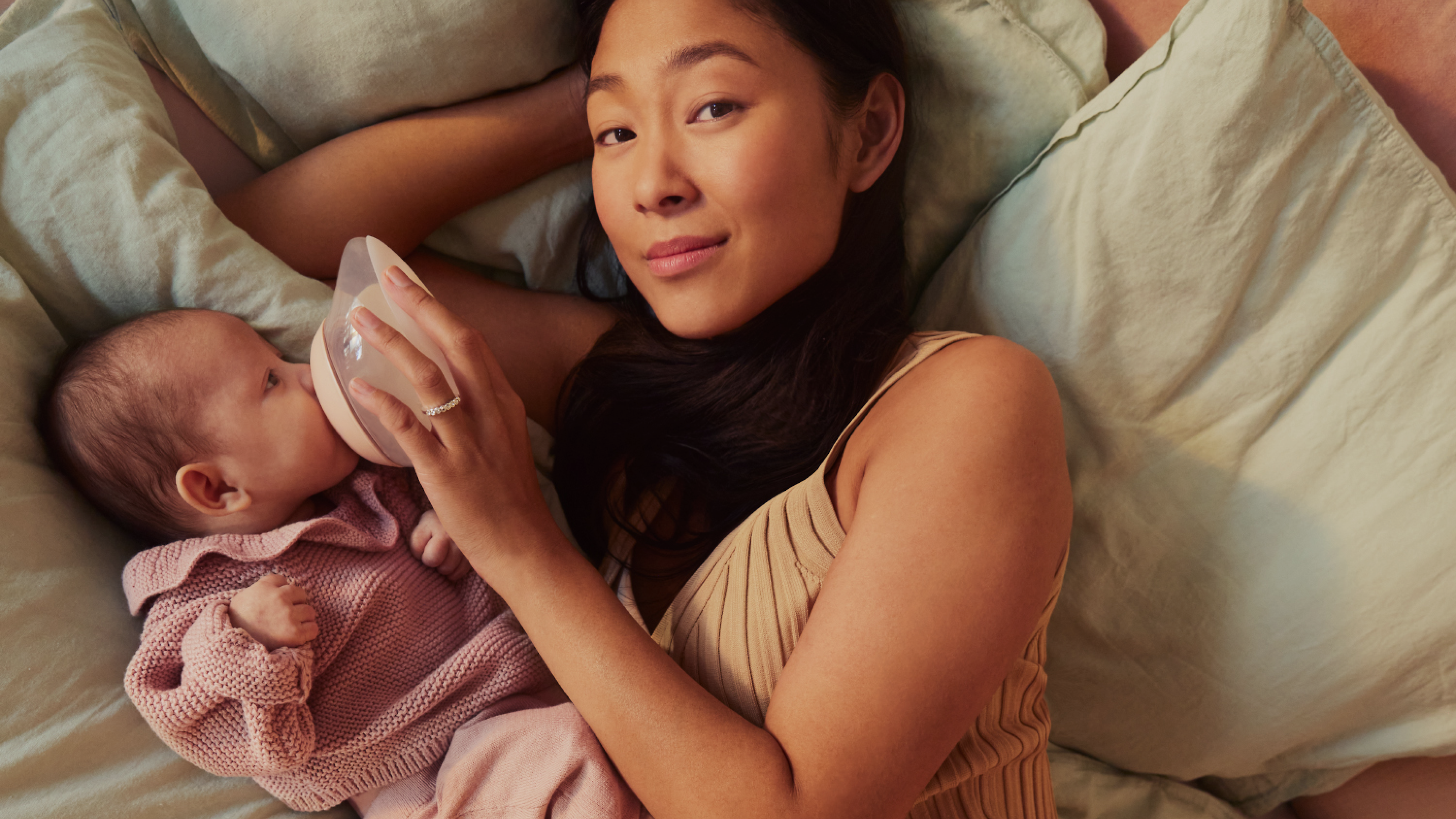 Baby drinking from the Emulait bottle designed to mimic breastfeeding